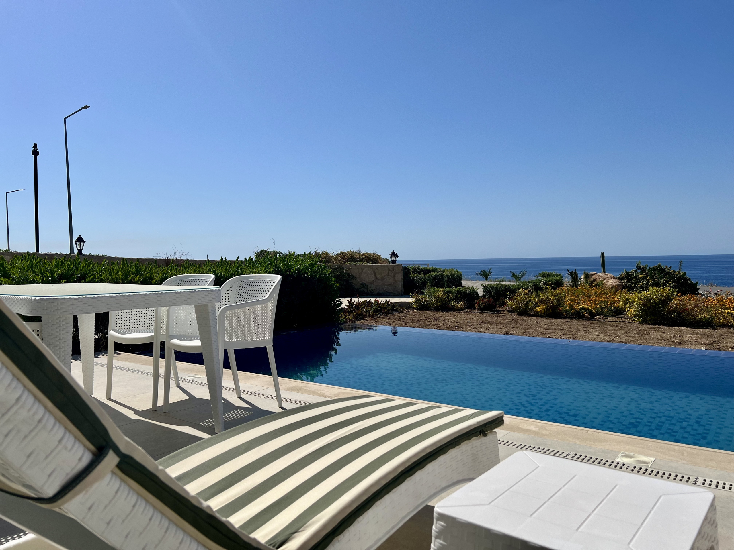 Sea front 3 bedroom garden apartment with private swimming pool